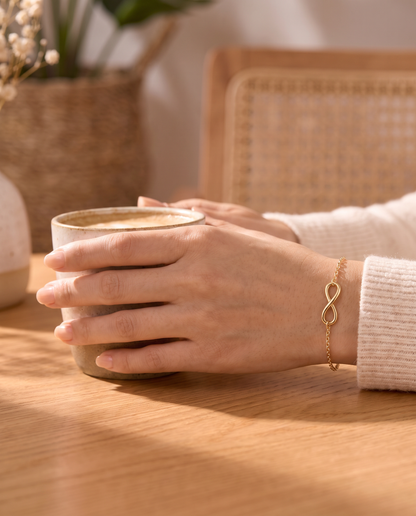Infinity Bracelet worn with a coffee cup